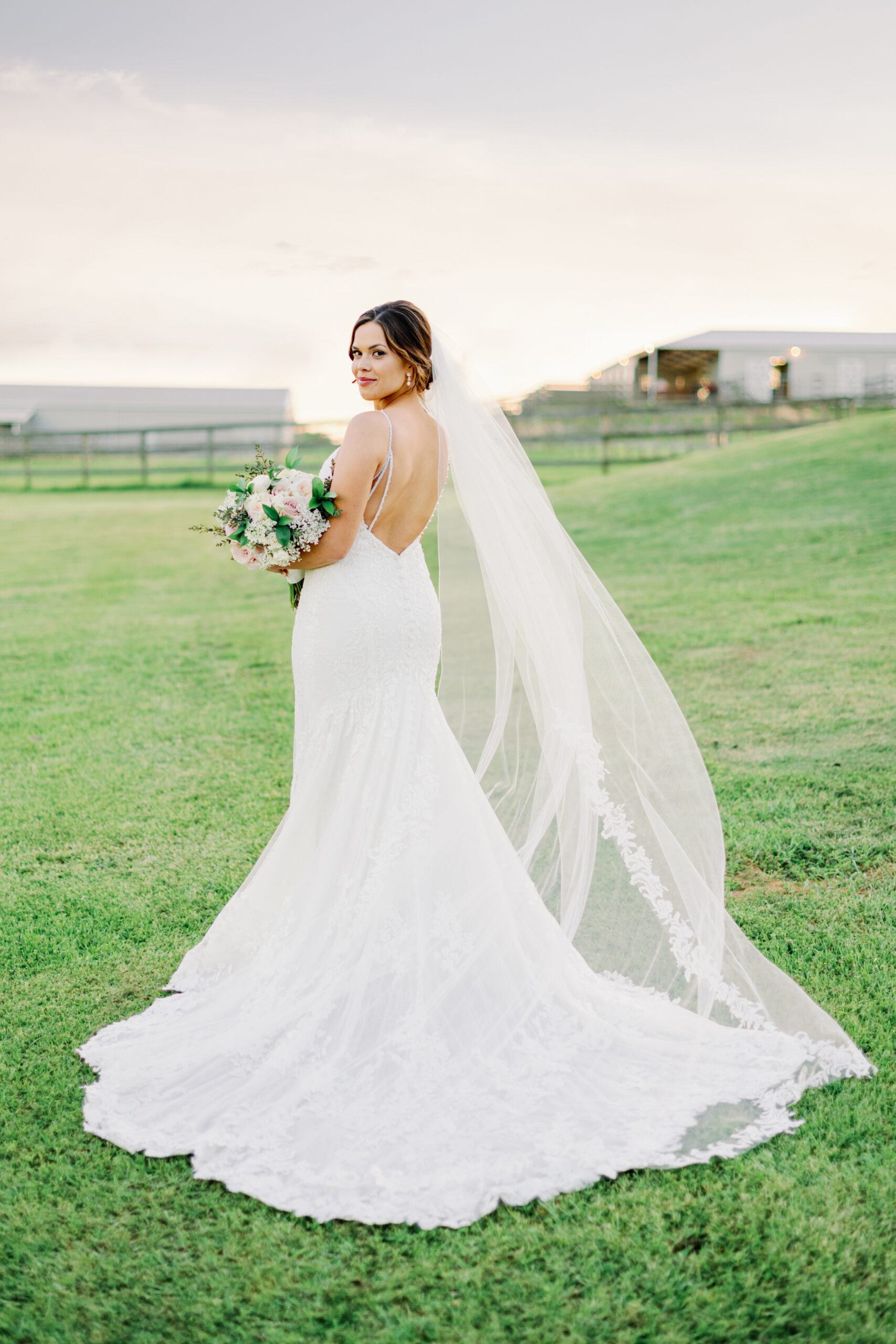 Bride Abbey poses for her bridals with Kati Hewitt Photography outdoors at Houston's The Farmhouse Wedding Venue