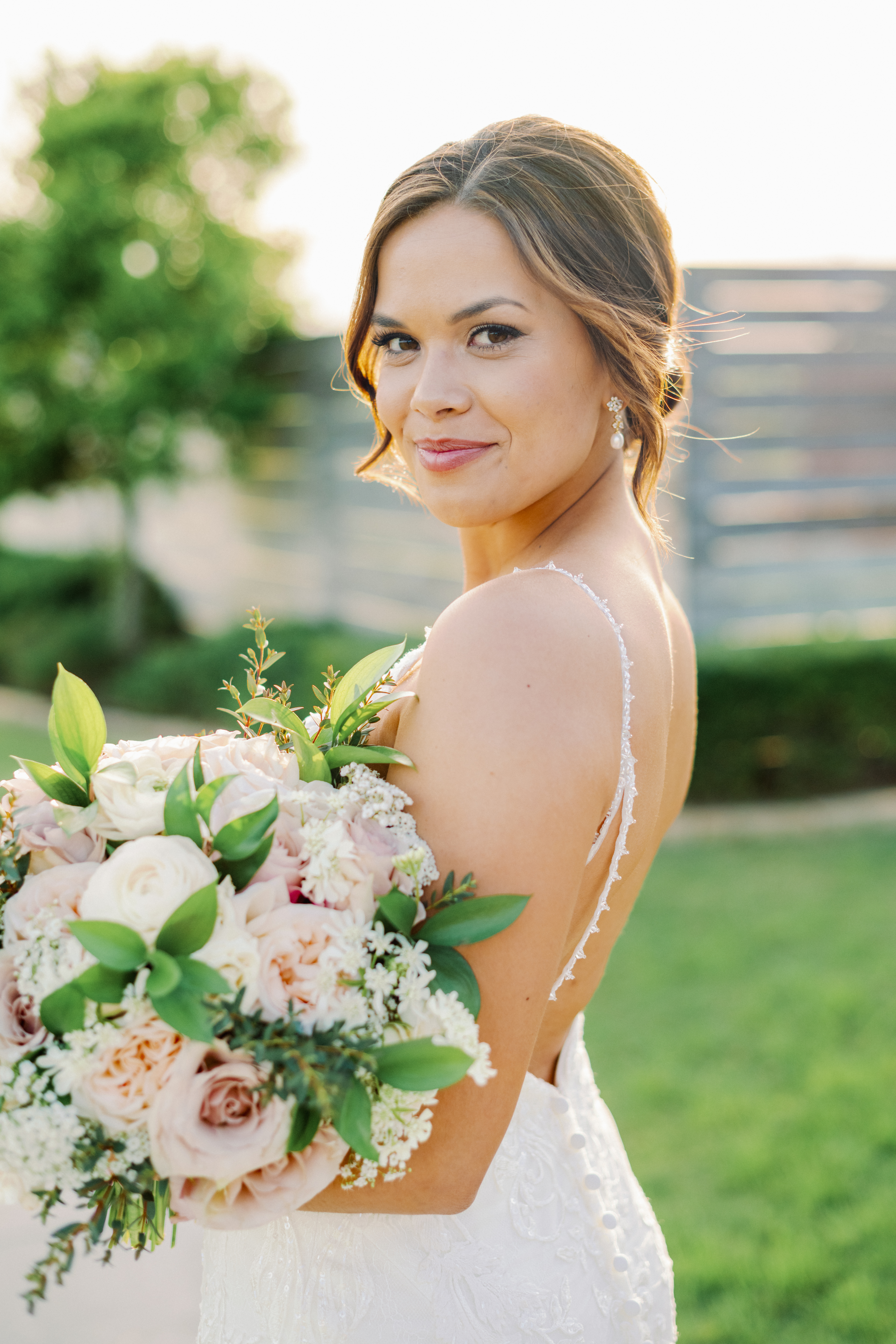 Bride Abbey poses for her bridals with Kati Hewitt Photography outdoors at Houston's The Farmhouse Wedding Venue